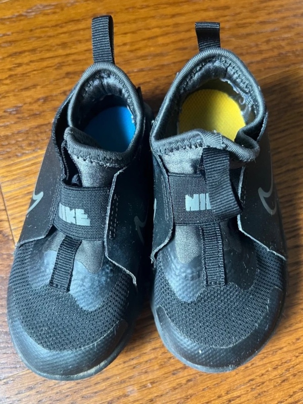 Nike Kids Black Slip-On Sneakers with Blue and Yellow Insoles